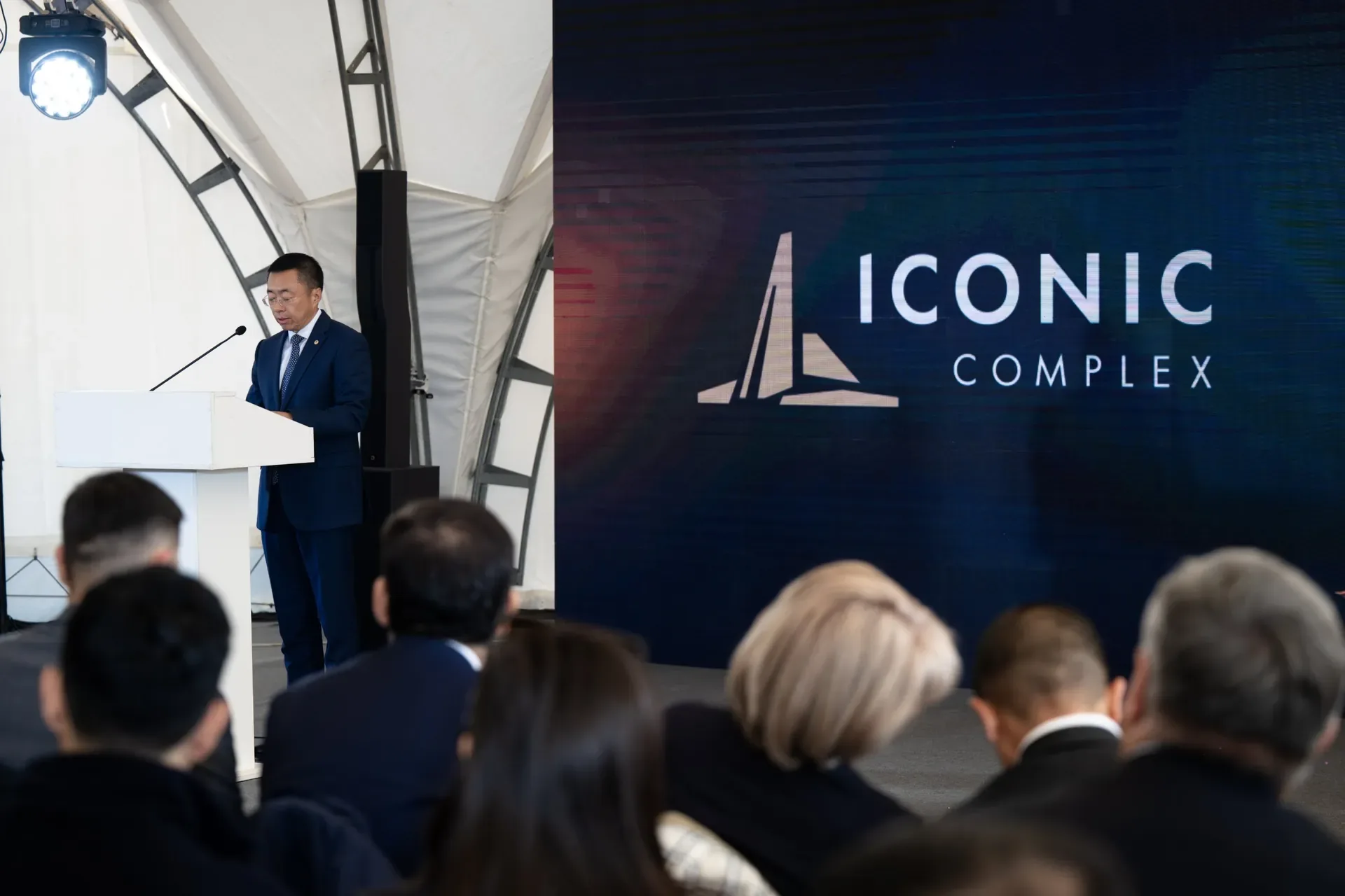 Speech at the ceremony against the Iconic Complex logo